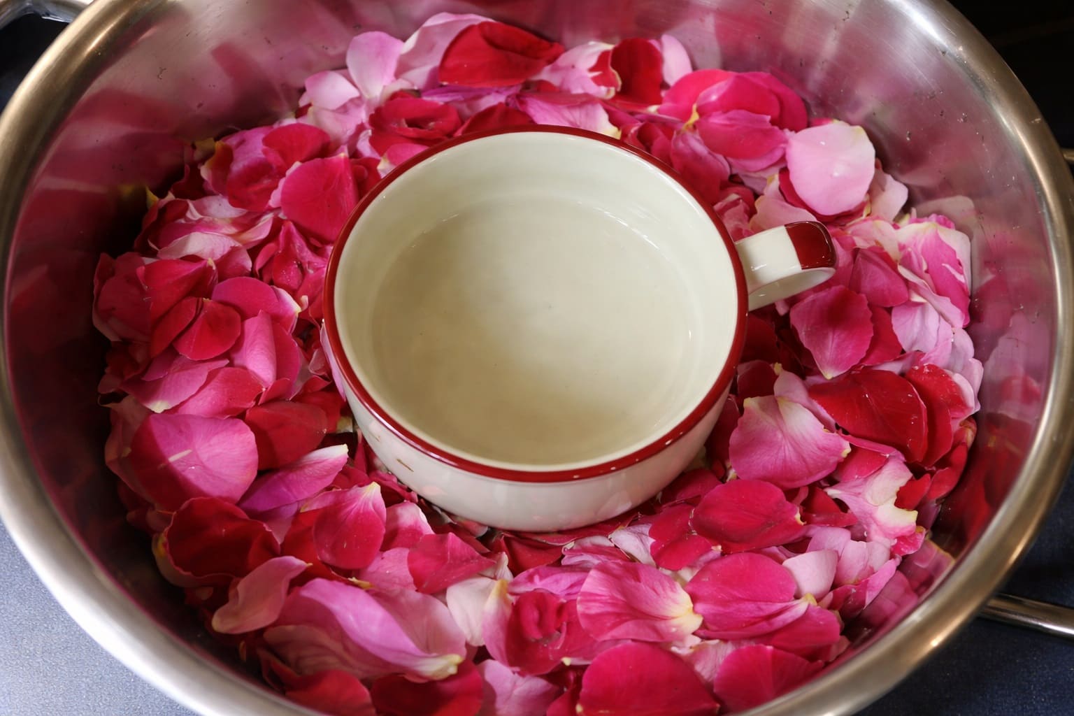 Add rose petals and water