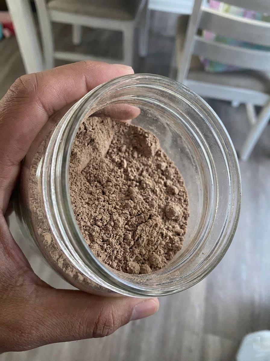 Transferring finished bone meal into a glass jar