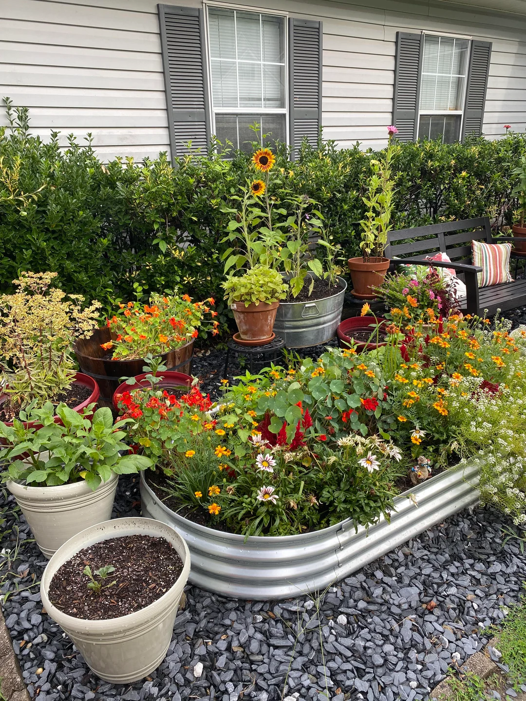 Sink containers into the flower bed
