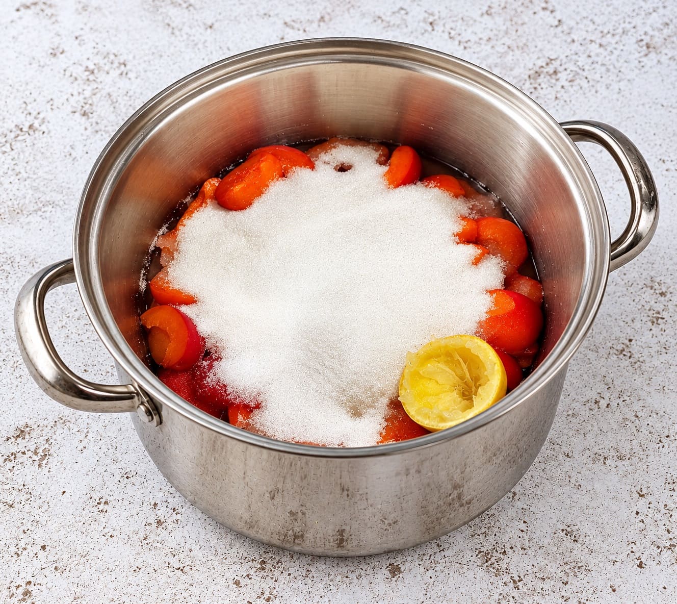 Stir the apricots with sugar and lemon juice